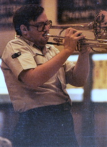 Jeff playing the valve trombone at a high school show in the Air Force band